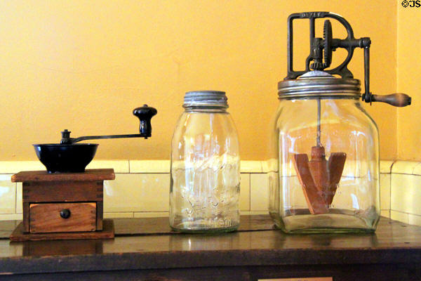Coffee grinder, canning jar & churn in kitchen at Rosemount House Museum. Pueblo, CO.