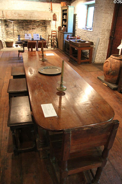 Table (c1640-50) with platter (late 17thC), candlesticks (17thC) & stools (c1650-1700) at Henry Whitfield State Museum. Guilford, CT.