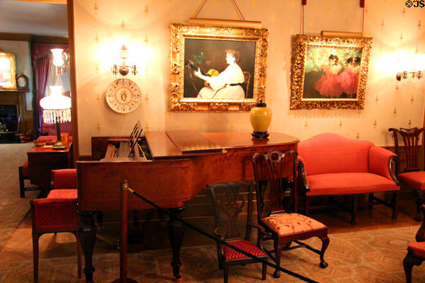 Drawing room view of Steinway grand piano (1901) under French Impressionist paintings at Hill-Stead Museum. Farmington, CT.