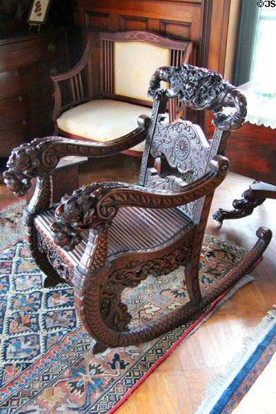 Rocking chair with dragons carved on arms at Isham-Terry House Museum. Hartford, CT.