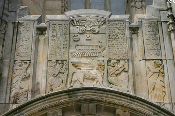 History of writing relief showing Neolithic cave paintings, Egyptian hieroglyphics, cuneiform, & Hebrew carved above portal of Sterling Memorial Library. New Haven, CT.
