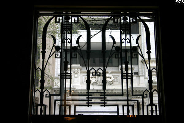 Art Deco grill over door of Walker Building with view to Folger Building. Washington, DC. Style: Art Deco.