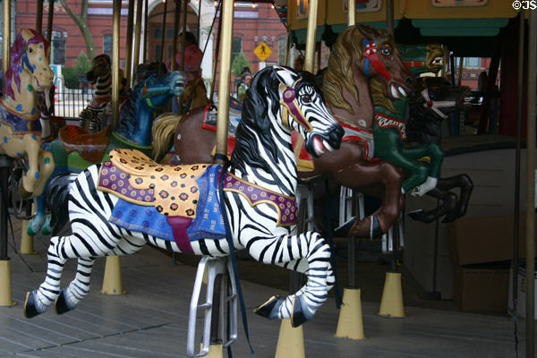 Carousel horses in front of Smithsonian Building. Washington, DC. Architect: James Renwick.