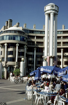 Riverside dining at Washington Harbor surrounded by modern buildings reflecting classical elements of nearby Georgetown. Washington, DC.