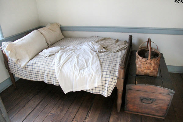 Small bedroom with chair railing at Old Stone House. Washington, DC.