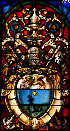 Stained glass window of lion of St. Marks on papal crown in Cathedral. St Augustine, FL.