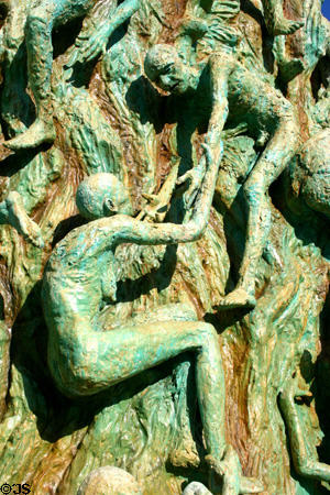 Man reaches back to save woman at Holocaust Memorial. Miami Beach, FL.