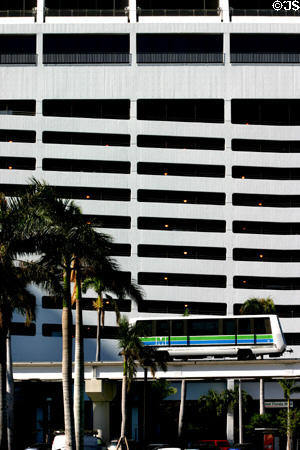 Miami Metromover car against downtown parking structure. Miami, FL.