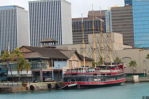 M/V Kulamanu four-masted passenger tour ship docked at closed Hawaii Maritime Center against Honolulu skyline. Honolulu, HI.
