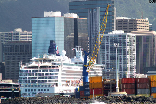 Pride of America against skyline of Honolulu. Honolulu, HI.