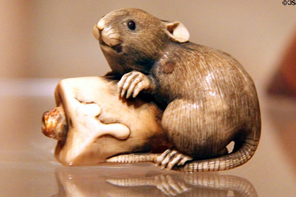 Japanese ivory netsuke with rat & candle (1868-1912) at Honolulu Academy of Arts. Honolulu, HI.