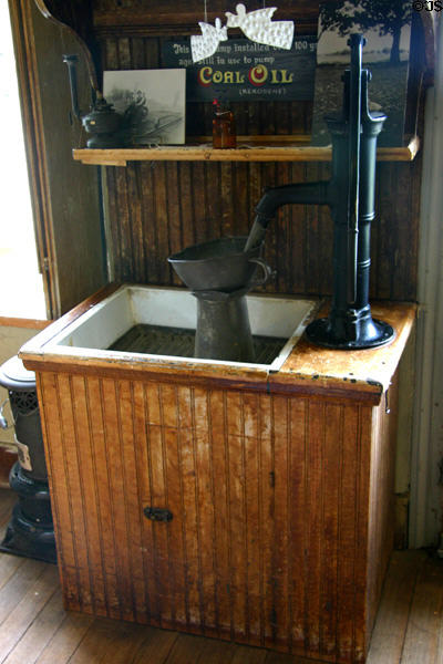 Sink with water hand pump in High Amana Store. High Amana, IA.