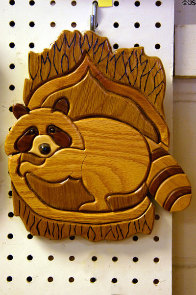 Wooden raccoon wall plaque at Schanz Furniture Shop. South Amana, IA.