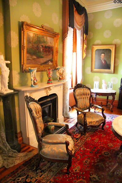 Fireplace & chairs in parlor at Dodge House. Council Bluffs, IA.