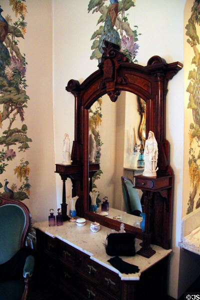 Dresser with mirror from walnut bedroom set displayed at 1876 Philadelphia Centennial Exposition at Dodge House. Council Bluffs, IA.