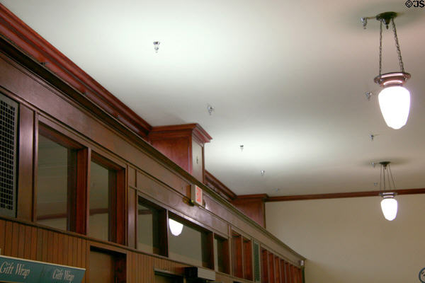 Interior front wall woodwork & lamps in Van Allen Dry Goods Store. Clinton, IA.
