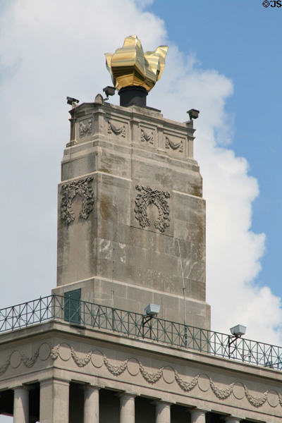 Golden flame & garlands atop Veterans' Memorial & City Hall. Cedar Rapids, IA.