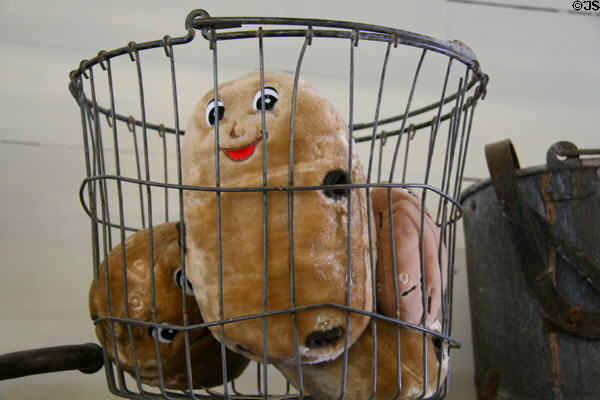 Plush potato toys in harvest basket at Idaho Potato Museum. Blackfoot, ID.