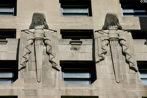 Two Babylonian-themed sculpted guards with swords carved on InterContinental Chicago building. Chicago, IL.