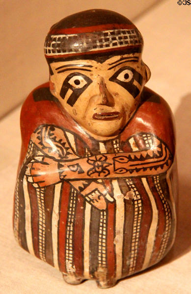 Nazca ceramic vessel in form of seated figure with tattooed arms (180 BCE-500 CE) from South Coast, Peru at Art Institute of Chicago. Chicago, IL.
