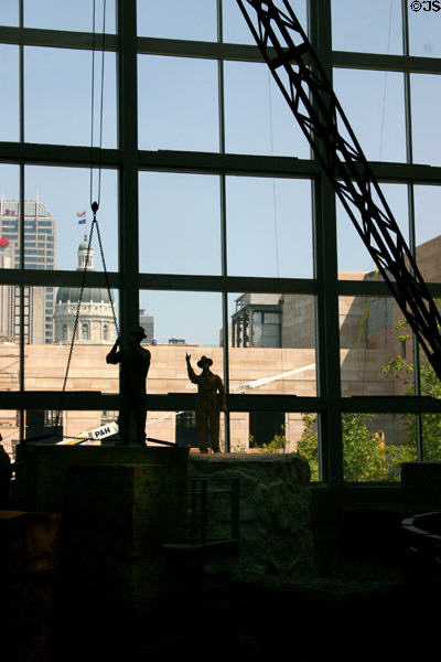 Stone quarrying figures against State Capitol made of Indiana stone Indiana State Museum. Indianapolis, IN.
