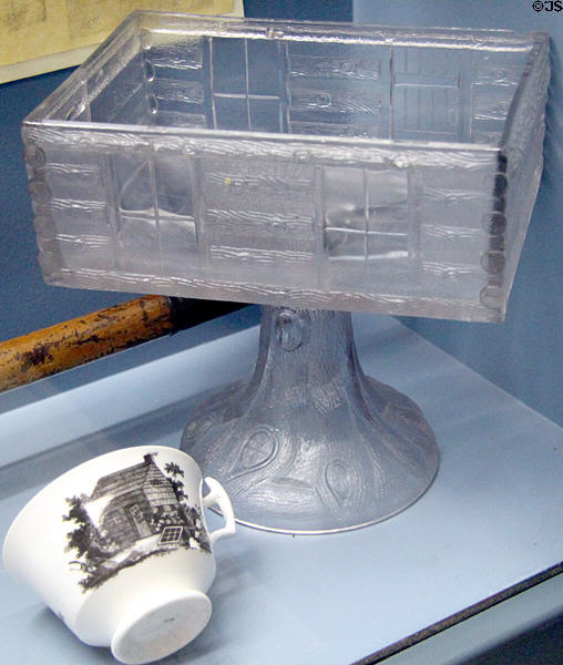 Pressed glass log cabin compote on stand & cup with log cabin campaign pieces for William Henry Harrison at Grouseland. Vincennes, IN.