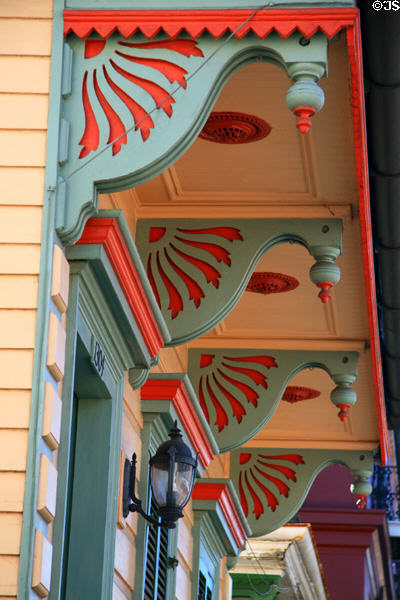 Red & gray brackets of shotgun double house (1304 Chartres St.). New Orleans, LA.