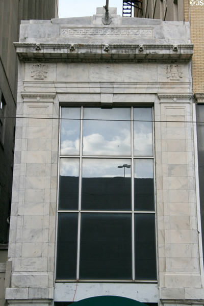 Small stone building on St. Charles Ave. tucked between Masonic & United Fruit Co. buildings. New Orleans, LA.