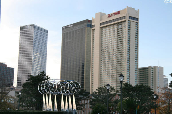 Ocean Song sculpture by John T. Scott in Woldenberg Riverfront Park against Shell Square, Sheraton & Marriot Hotels. New Orleans, LA.