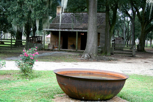Summer kitchen outbuilding & sugar boiling kettle at Destrehan Plantation. Destrehan, LA.