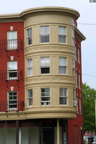 Round corner turret on residential building (Bridge St. at Canal St.). Lowell, MA.