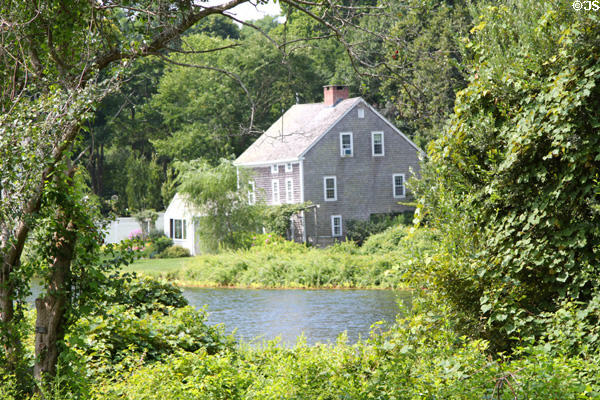 View of heritage house across Sandwich pond. Sandwich, MA.