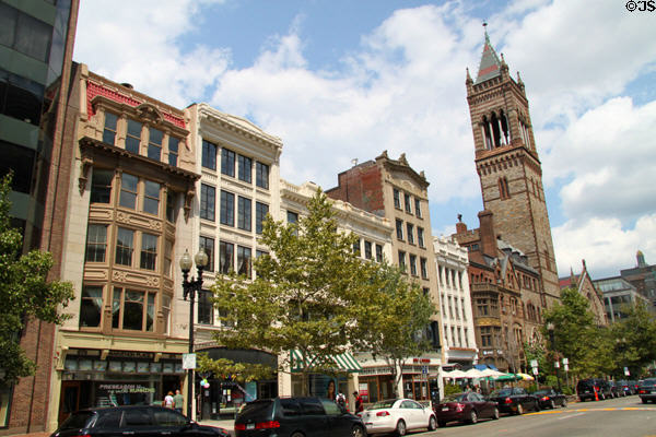 Row of commercial heritage buildings (most 1915) (673-635 Boylston St.) with tower of New Old South Church at end. Boston, MA.
