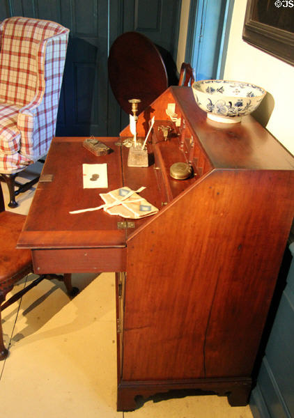 Desk (1750-75) from New England with English or Dutch Punchbowl, coin scales, snuff box, snuffers & ink well in Mid 18th C room at Concord Museum. Concord, MA.