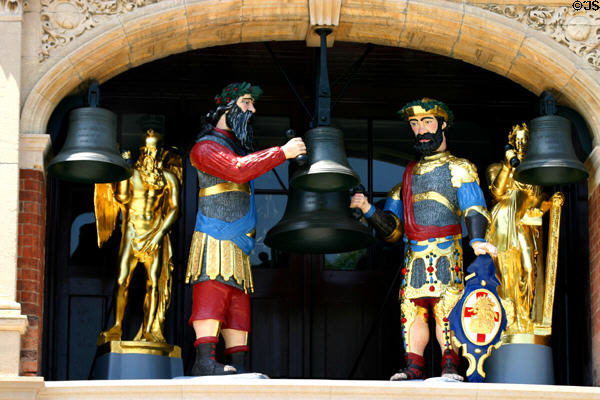 Carved bell ringing figures on clock tower of Sir John Bennett Jewelry Shop at Greenfield Village. Dearborn, MI.