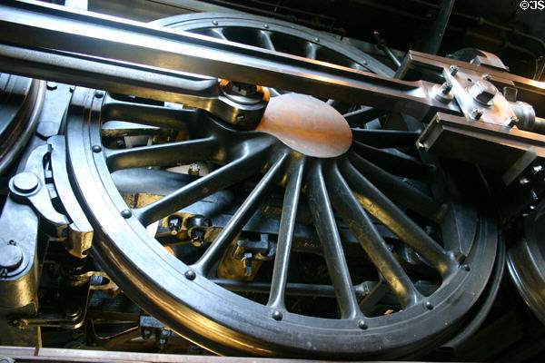 Drive wheel of Schenectady Locomotive Works steam engine (1902) in roundhouse of Greenfield Village. Dearborn, MI.