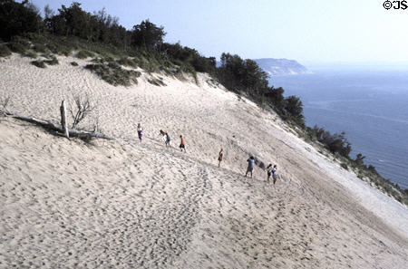 Visitors climb dunes in Sleeping Bear National Park on Lake Michigan. MI.
