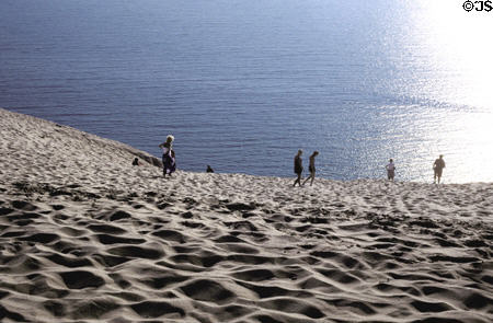 Giant sand dune towers over Lake Michigan in Sleeping Bear National Park. MI.