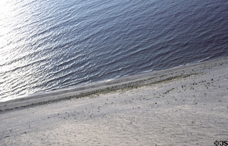 Looking down sand dune to waves of Lake Michigan in Sleeping Bear National Park. MI.