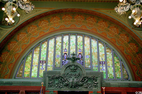 Arch with stained glass windows over entrance of National Farmer's Bank. Owatonna, MN.