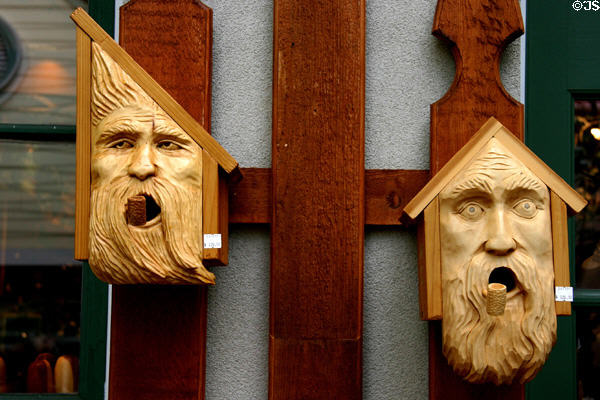Carved faces bird houses at Grand Village shopping center. Branson, MO.