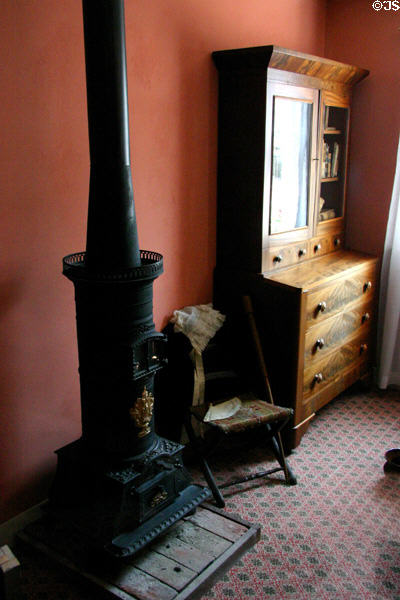 Stove & desk in parlor of Mark Twain Boyhood Home. Hannibal, MO.