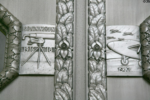 Cast aluminum door detail of Browning machine gun 1916-18 & aircraft 1940 at War Memorial Building. Jackson, MS. Style: Art Deco.