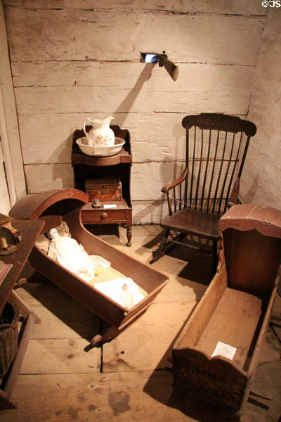 Gun port over cradles, wash stand, & rocking chair in Garrison house at Woodman Museum. Dover, NH.