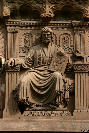 Seated symbol of learning with book of knowledge on his knee carved on Alexander Hall on Princeton campus. Princeton, NJ.