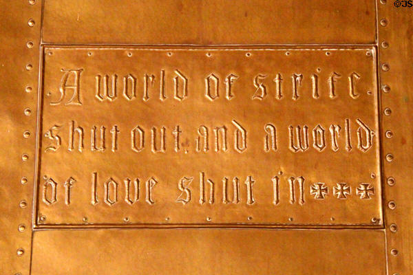 Fireplace copper repousse slogan 'A world of strife shut out and a world of love shut in�' at Craftsman Farms. Morris Plains, NJ.