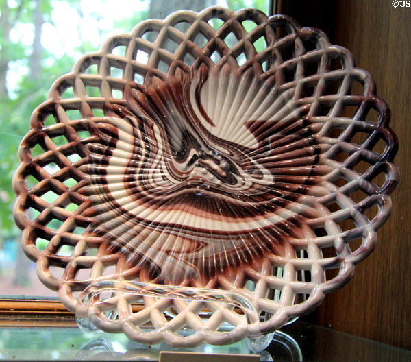 Open lattice rim pressed glass plate (c1891) by Challinor, Taylor & Co. of Tarentum, PA at Museum of American Glass. Milville, NJ.
