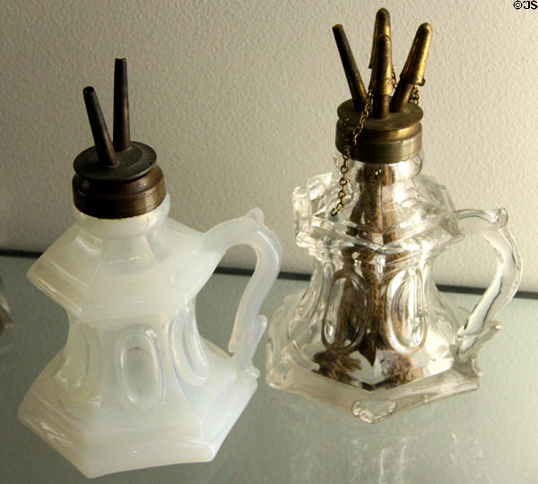 Pressed glass "Waisted loop" whale oil lamps (1840-50) with two or four wicks by Boston & Sandwich Glass Co. of Sandwich, MA at Museum of American Glass. Milville, NJ.