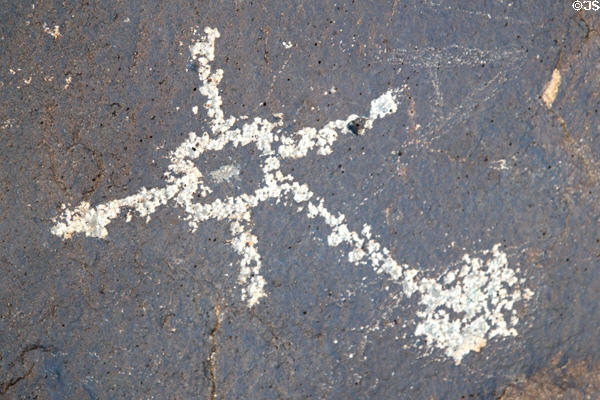 Petroglyph with cross at Petroglyph National Monument. Albuquerque, NM.