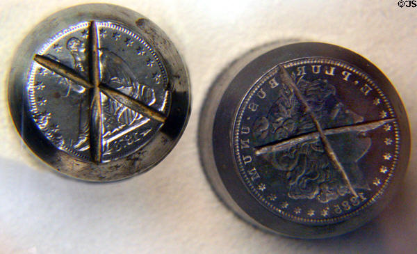 Carson City Mint cancelled coin dies for 1885 silver dollar & 1873 half dollar in Nevada State Museum. Carson City, NV.